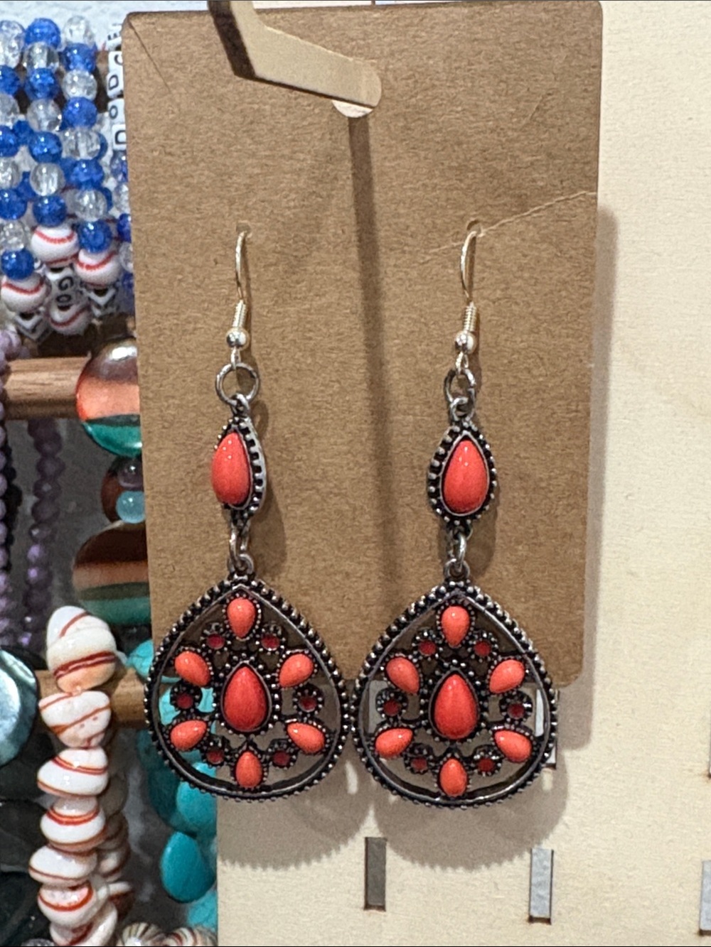 Handcrafted pendant coral colored dangle earrings